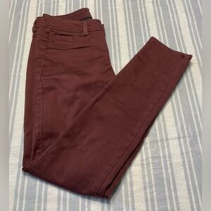 Roz & Ali eggplant colored skinny jeans.